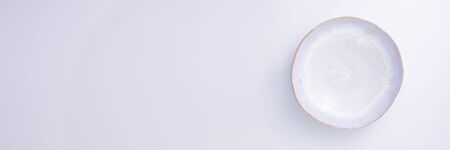 White ceramic plate isolated on white background. Copy space. Banner.の写真素材