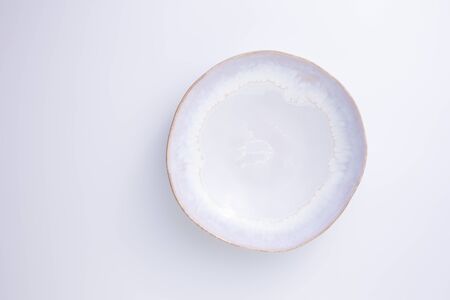 White ceramic plate isolated on white background. Copy space.