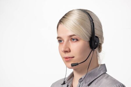 Portrait of an employee call center on white background. Support operator. Close-up.の写真素材