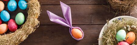 Still life of easter eggs in a bird's nest on a wooden background. Rustic. Decoration of natural....
