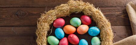 Still life of easter eggs in a bird's nest on a wooden background. Rustic. Decoration of natural....