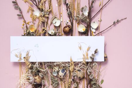 Collect easter composition on a pale pink background. Dried flowers and eggs for a beautiful...