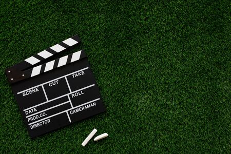 Filmmaking concept. Movie Clapperboard. Cinema begins with movie clappers. Top view. Copy space. Place for your text.の写真素材