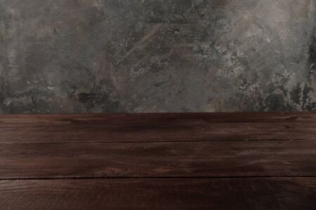 Image of wooden table in front of abstract blurred background. Empty wooden table platform over...