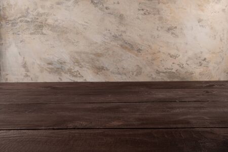 Image of wooden table in front of abstract blurred background. Empty wooden table platform over background for present product.の写真素材