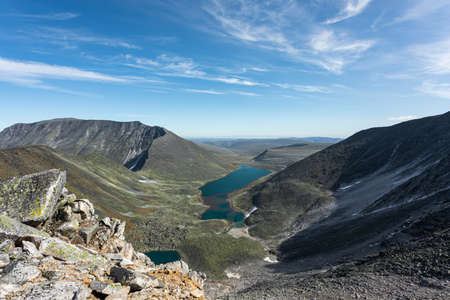 Mountain landscape, lake and mountain range, large panorama. The concept of outdoor activities and tourism.の写真素材