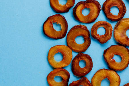 slices of dried plum on a blue background. dried fruits. eco.top view.