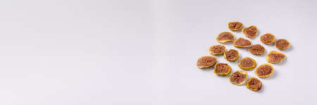 slices of dried figs on a white background. dried fruits. eco. top view. delicacy.の写真素材