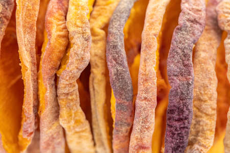 slices of dried peach on a white background. dried fruits. eco. macro. delicacy.の写真素材