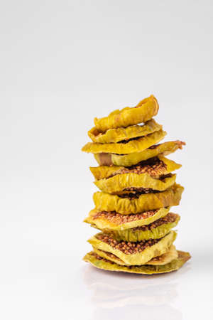 slices of dried figs on a white background. dried fruits.の写真素材