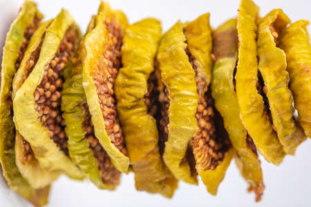 slices of dried figs on a white background. dried fruits. eco. macro. delicacy.の写真素材