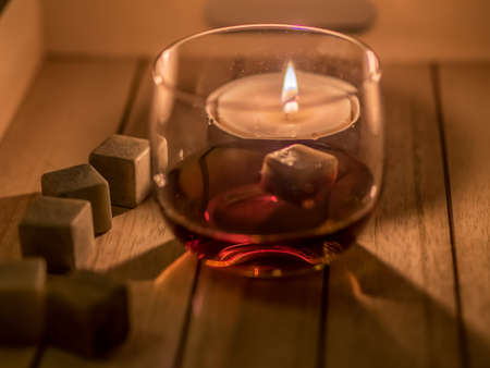 still life with rum and candleの写真素材
