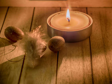 still life with easter egg and candle