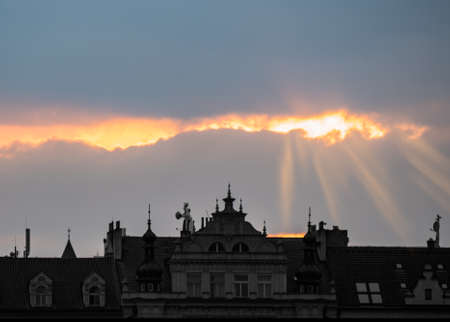 Evening with sunrays above the old buildingの写真素材