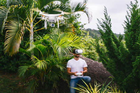 Man controls a quadrocopter