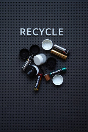 Russia, Irkutsk - February 8, 2021: Toshiba, Panasonic, and Energizer batteries with Coca-Cola lids...