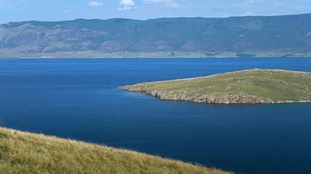 Blue lake, small green islands and hilly peninsula. Summer in nature, Europe. Earth day concept