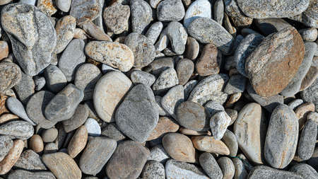 Big and small flat stones. Wallpaper or background. Earth day concept.