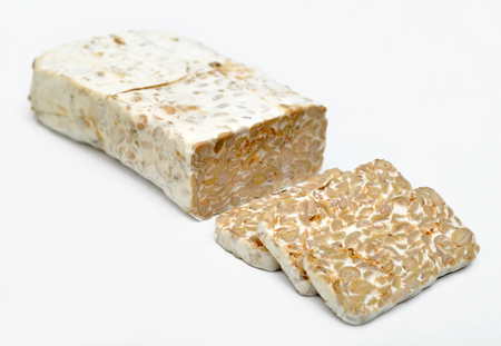 Tempe/tempeh is a traditional soy product originally from Indonesia. It is made by a natural culturing and controlled fermentation process that binds soybeans into a cake form.の写真素材