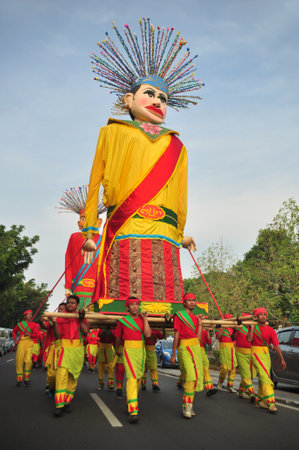Jakarta, Indonesia - October 28, 2012 : People carry giant ondel-ondel in Jakarta Carnival eventsのeditorial素材