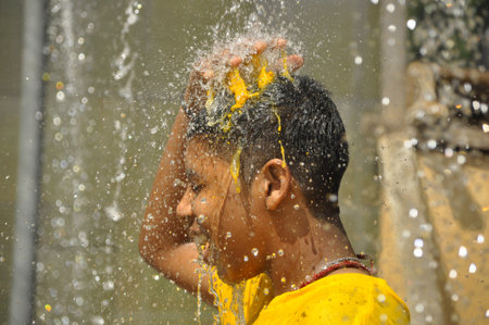 Kuala Lumpur, Malaysia - February 2, 2015: Hindu Tamils who participate in Thaipusam take a bath and purify themselves before attending the Thaipusam ceremony at Batu Caves, Kuala Lumpur, Malaysiaのeditorial素材