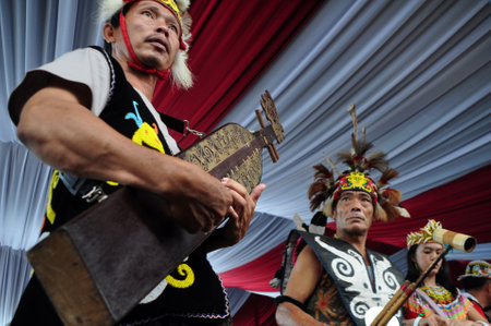 Dayak people are playing Sape the  traditional guitar from Dayak Borneo, Kalimantan, Indonesia.のeditorial素材