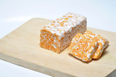 Slice of tempeh on table, tempeh is traditional food from Indonesia.の写真素材