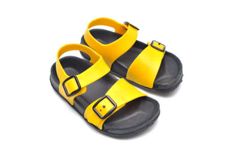 Black and yellow children's sandals made of rubberの写真素材