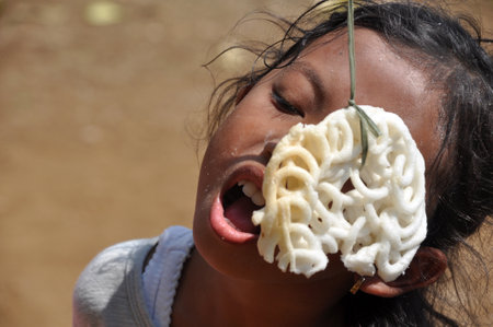 Ciamis, Indonesia - August 17, 2019: Kerupuk eating competition in Indonesia Independence Day celebrationのeditorial素材