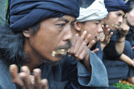 Bandung, Indonesia - June 22, 2014: Sundanese musician playing Karinding music at Sundanese traditional ceremony, Bandung - Indonesiaのeditorial素材