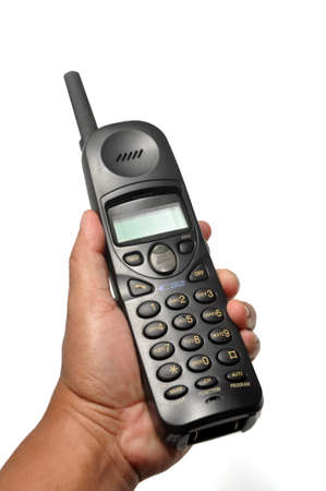 Holding cordless telephone or portable telephone white background
