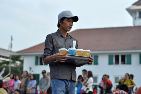 Jakarta, Indonesia - January 17, 2015 : Peddlers of cold drinks selling in the courtyard of Fatahillah Park, Jakarta - Indonesiaのeditorial素材