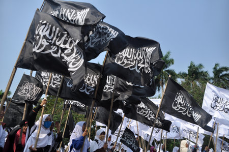 Jakarta, Indonesia - June 13, 2015: Hundreds of people from Hizbut Tahrir Indonesia long march in the main streets of Jakarta, Indonesia.のeditorial素材