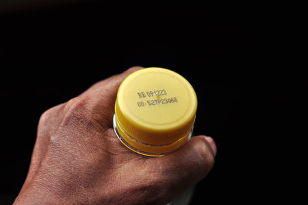 Expiry date written on the plastic bottle capの写真素材