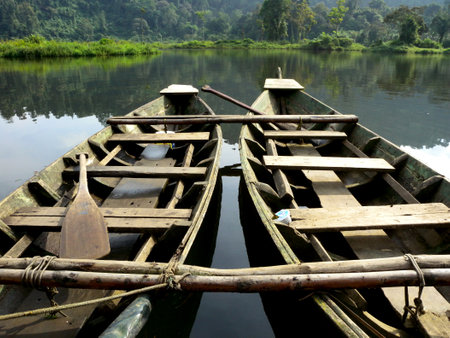 Two wooden boats on a lakeの写真素材