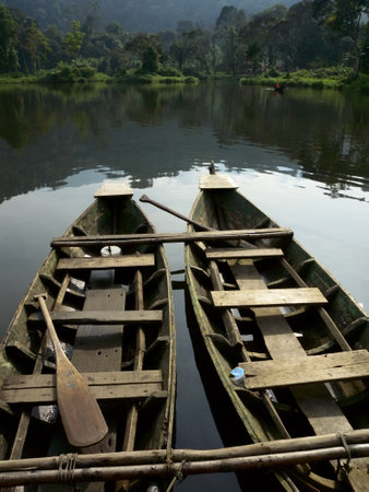 Two wooden boats on a lakeの写真素材