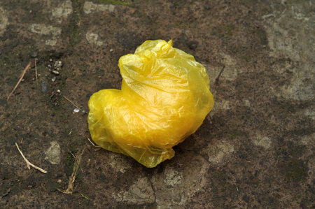 Yellow plastic bag waste pollutes the environment