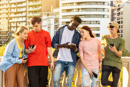 Group of diverse young people enjoying free time in the park. Main focus on blonde girl.