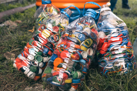 Detail of large quantity of colored plastic bottle caps. Recycled plastic bottle caps.Recycling...