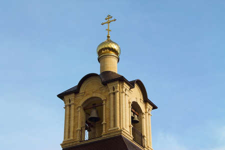 Belltower with a dome against the sky