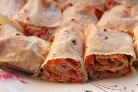 original sandwiches in lavash with the Korean carrots and sausageの写真素材