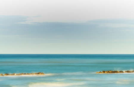 Painted sea in Porto San Giorgio during the sunset