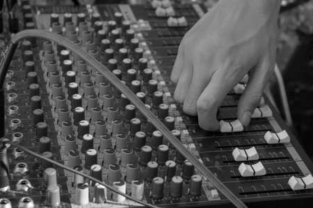 Dj holding mixer in night clubの写真素材