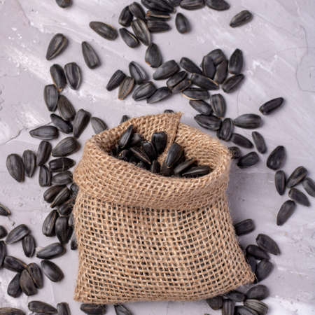 Burlap sacks with sunflower seeds, sackcloth with seeds, verticalの写真素材