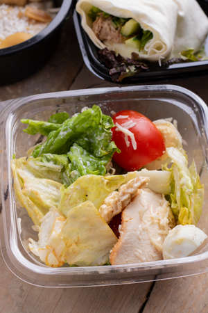 Plate with a keto diet food. Fried egg, bacon, avocado, arugula and strawberries. Keto breakfast.の写真素材