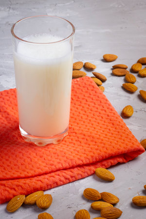 Almond milk in glass on gray background. Top view foodの写真素材