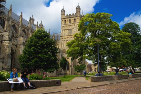 EXETER, UK - July 11 2016: people in the square near the walls of the cathedral in Exeter. Devon, Englandのeditorial素材