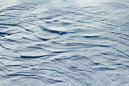Snow crust with small dunes. Many of curved linesの写真素材