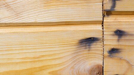 The joint wooden planks. Nails. The corrosion of the nailsの写真素材