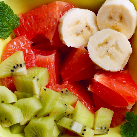 fruit salad of kiwi, banana and grapefruit. Close-upの写真素材